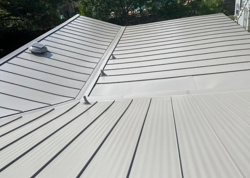 Solar attic fan installed on a metal roof for Roof Ventilation in Finneytown